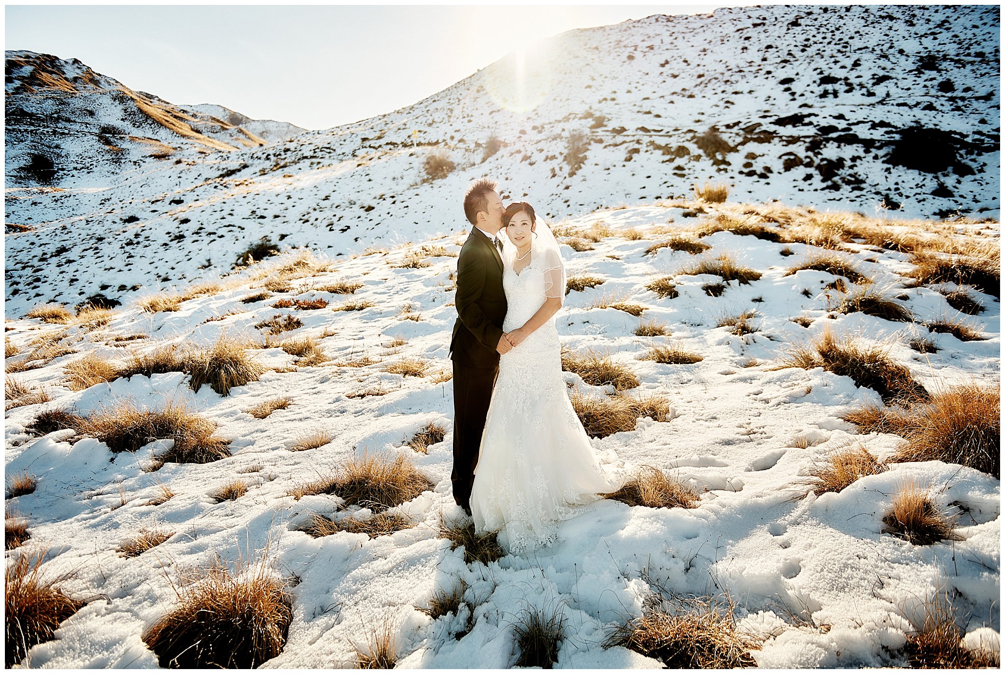 Yoshihiro and Michiko's post-wedding photoshoot in a snow-covered field in Queenstown, NZ.